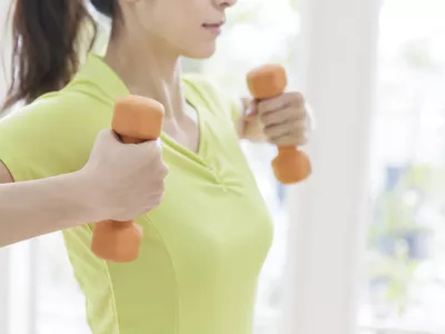 Young athlete lifting weights