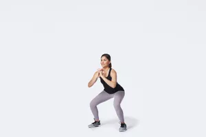 woman performing a squat