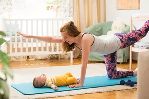 Woman exercising with her baby