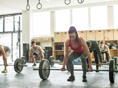 Group of people doing clean and press