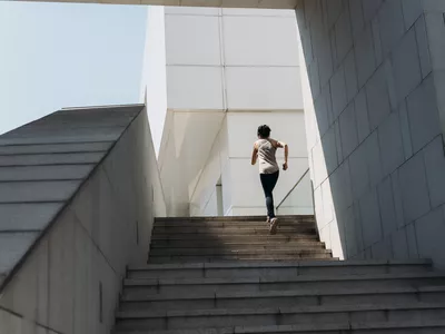 young woman running on the stairs