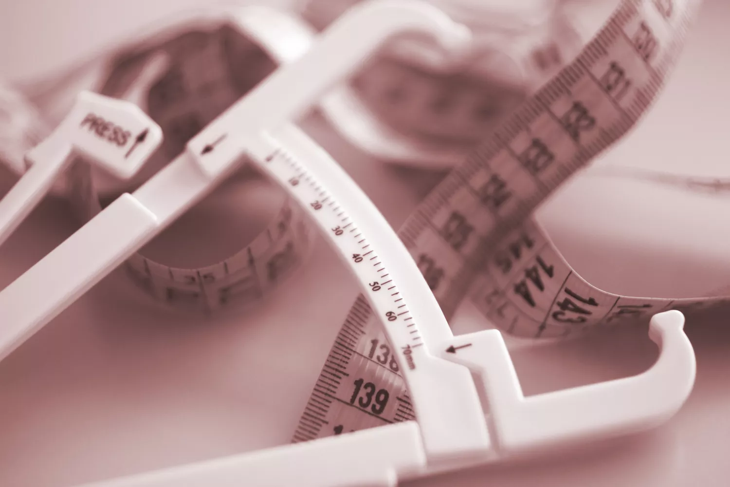Flexible measuring tape with skin fold calipers