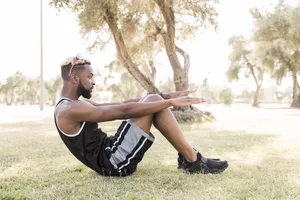Man doing situps outdoors