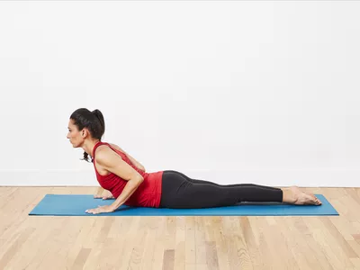 woman doing cobra pose