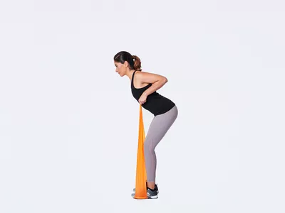 woman doing rows with band
