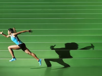 AThlete performing in green sportsarena