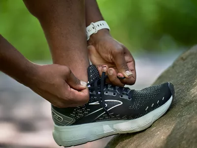 man tying his shoes
