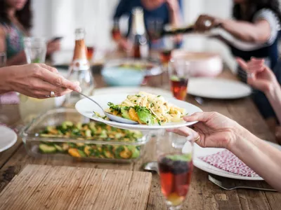 Scooping a portion onto a dinner plate