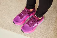 Person wearing Hoka Women's Bondi 8 Shoes on a beige carpet