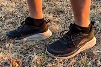 A close-up of legs wearing the Keen Men's WK400 II Walking Shoes in grass