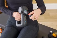 A person assembling the Theragun Prime