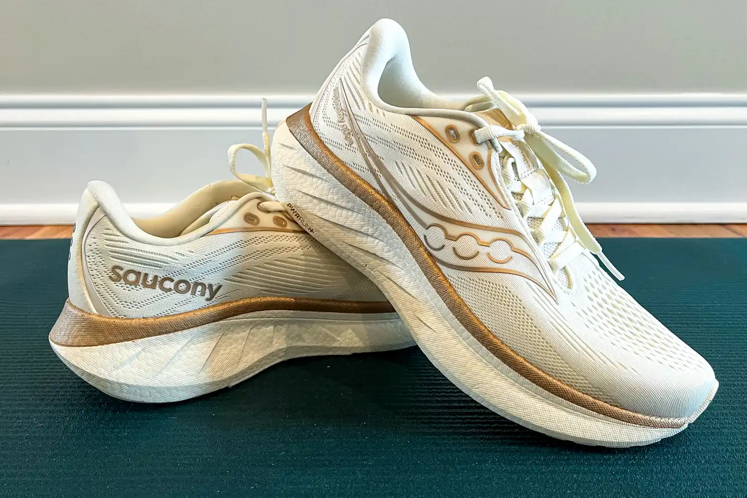 A pair of Saucony running shoes placed together indoors