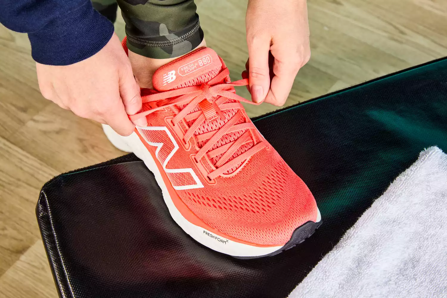 Person tying laces of New Balance Women's Fresh Foam X 880v14