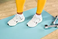 Person standing wearing Nike Women's Pegasus 40
