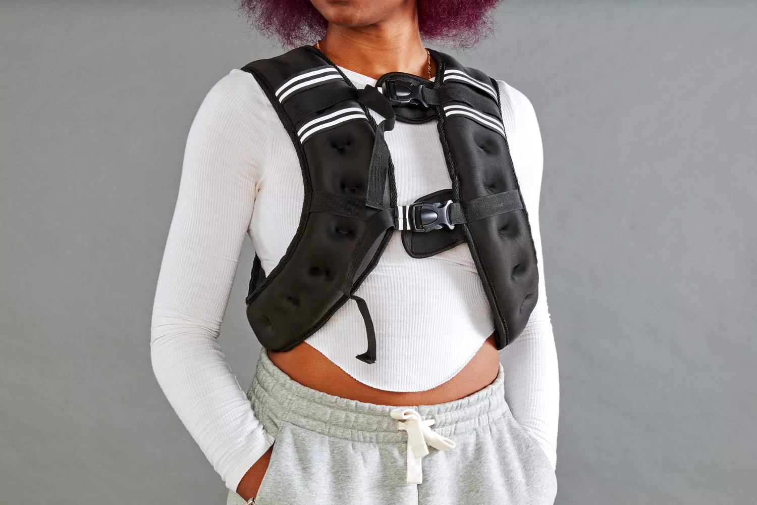 Person wearing Prodigen Weighted Vest with hands in pockets