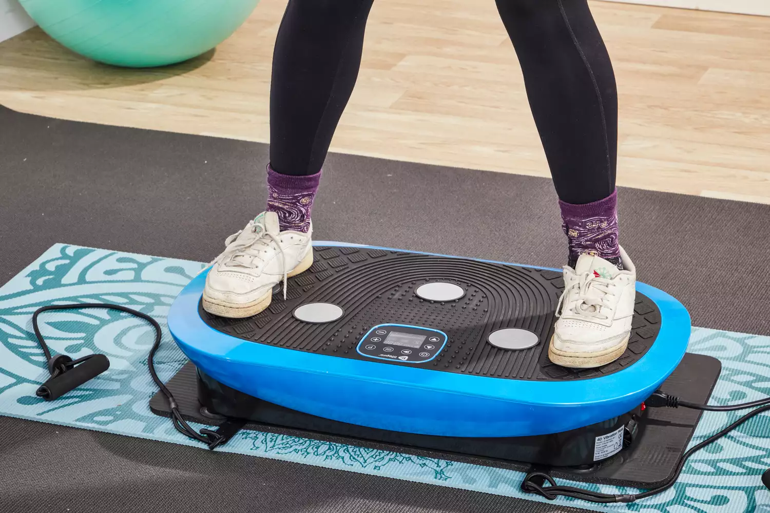 Legs stand on the LifePro Rumblex Plus 4D Vibration Plate Exercise Machine