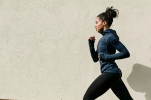 side view of woman running