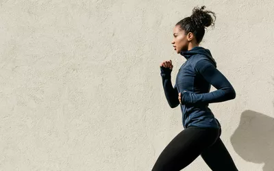 side view of woman running