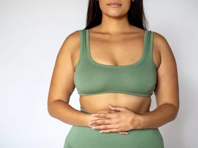 Woman holding her stomach
