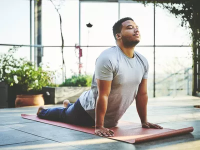 Man practicing Upward Facing Dog Pose
